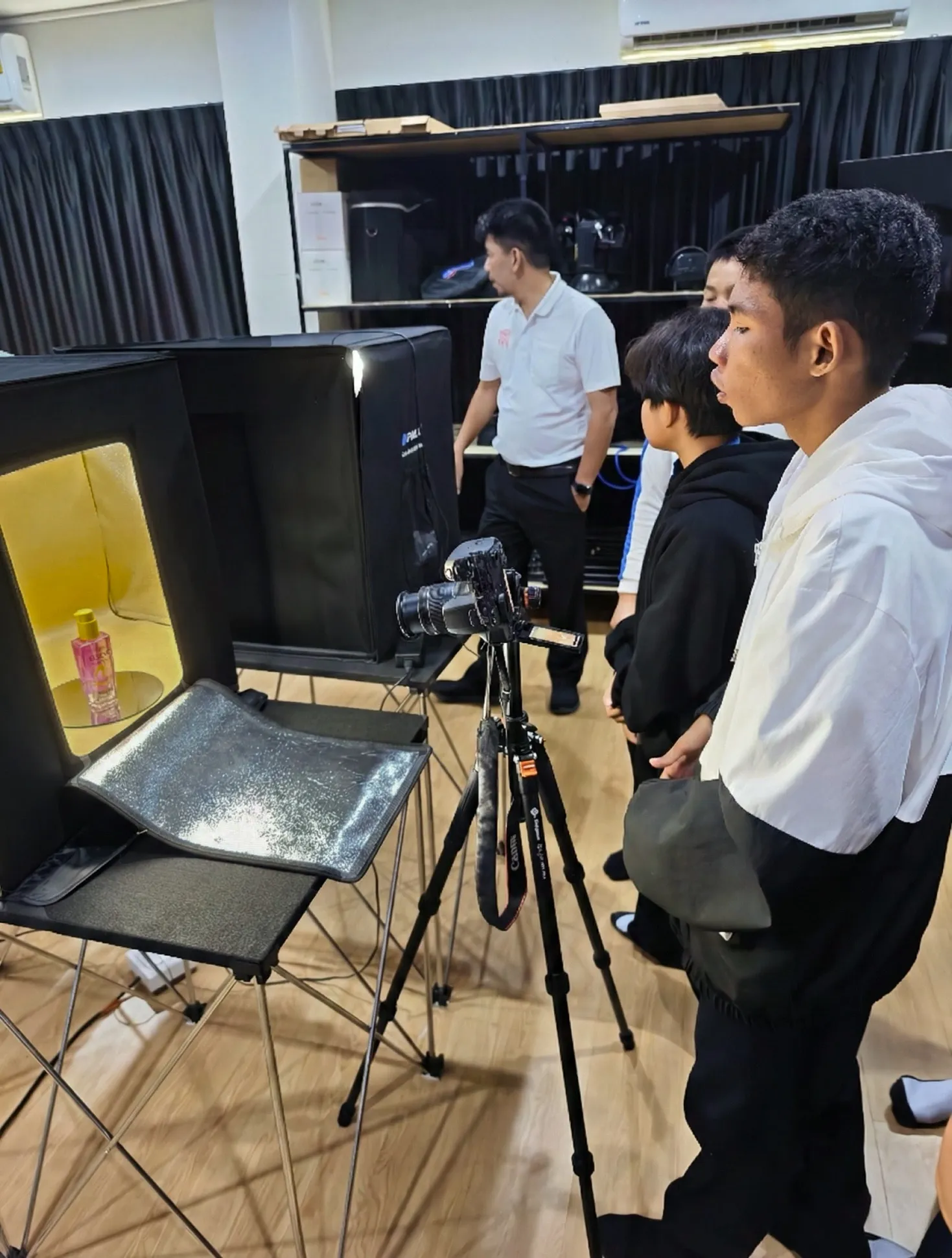 one of my classmates taking a picture for photo class.