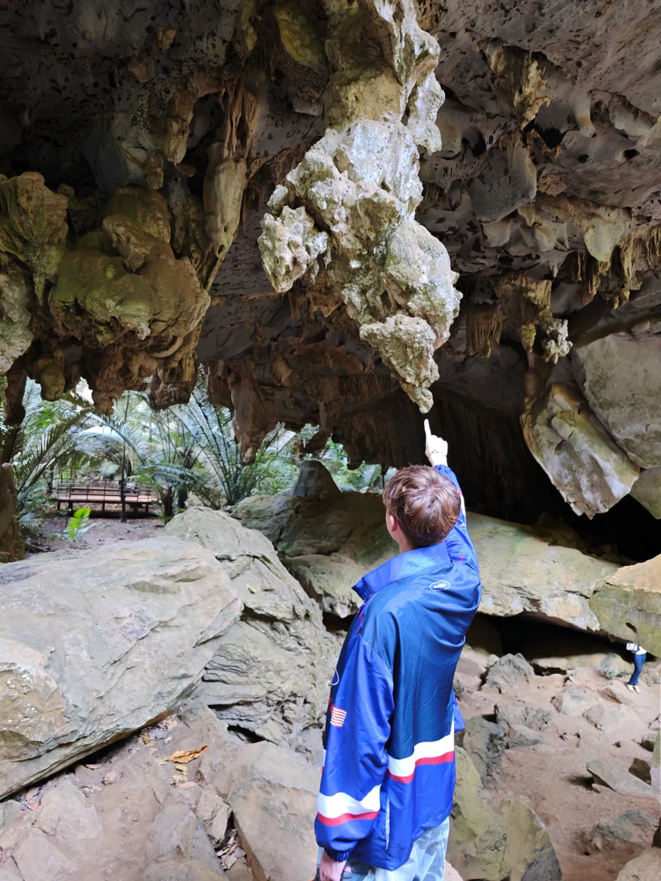 the outside of a rock arch in a nature park